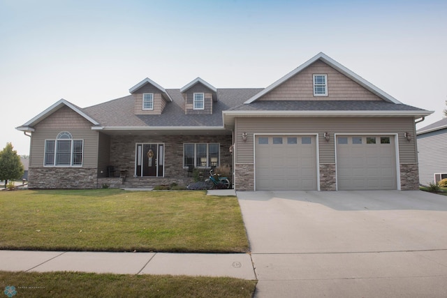 craftsman-style home featuring a front yard and a garage