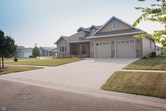 craftsman inspired home featuring a front yard and central air condition unit