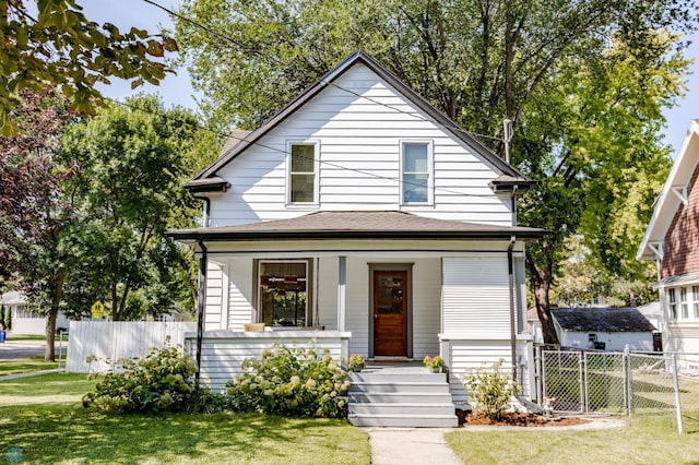 view of front of property featuring a front lawn and covered porch