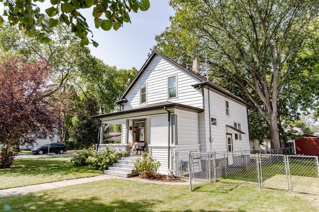 view of front of house featuring covered porch and a front yard