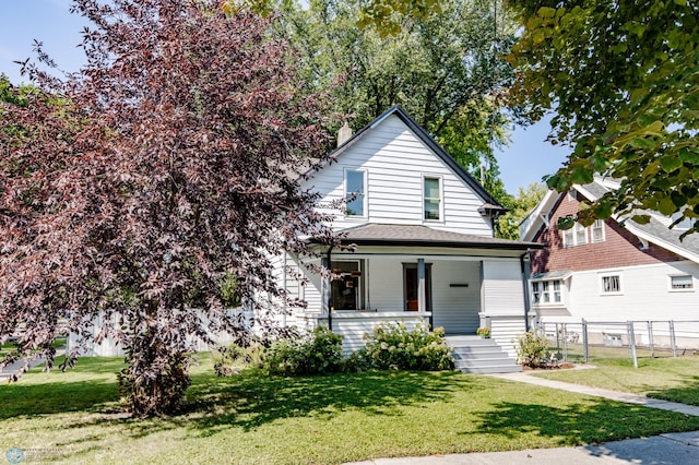 view of front of house with a front lawn and a porch