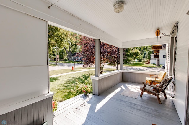 wooden terrace with a porch