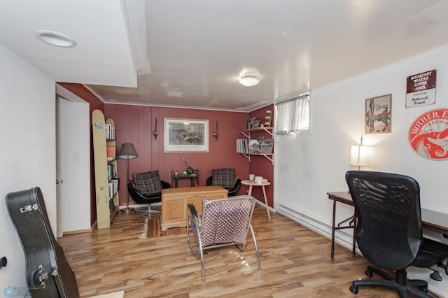 office with baseboard heating, wood-type flooring, and wooden walls