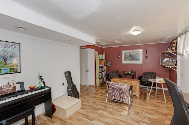 interior space with wooden walls and light hardwood / wood-style floors