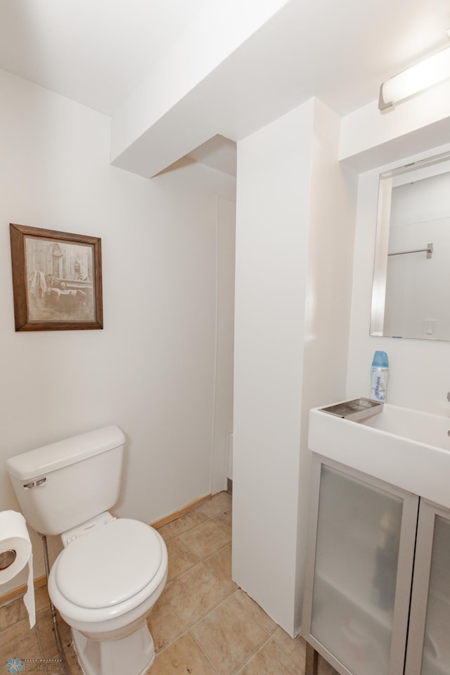 bathroom featuring toilet and tile patterned flooring