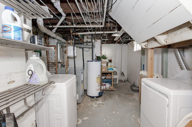 basement featuring washer and dryer and water heater