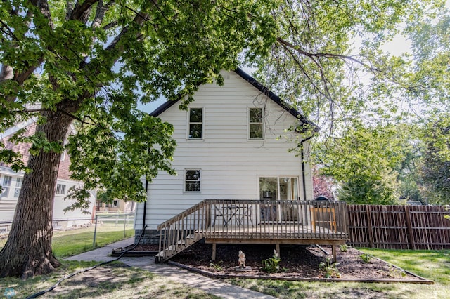 back of property featuring a deck