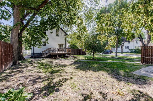 view of yard with a wooden deck