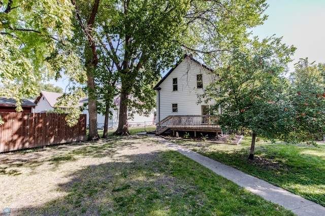 view of yard with a wooden deck