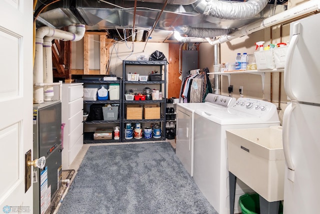 laundry room with sink and washer and dryer