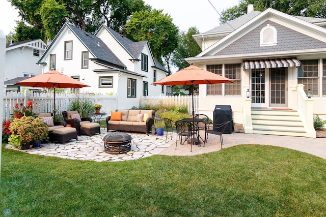 back of property featuring an outdoor fire pit, a patio area, and a yard