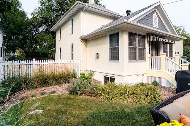 view of property exterior featuring a yard