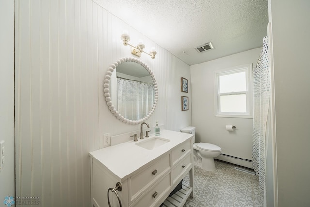 bathroom with a baseboard radiator, a textured ceiling, toilet, wood walls, and vanity