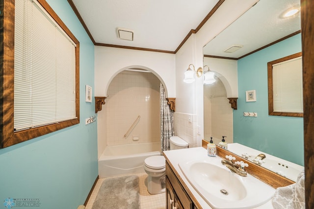 full bathroom with tile patterned floors, toilet, ornamental molding, tiled shower / bath combo, and vanity