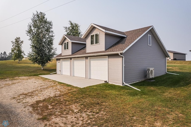 view of property exterior with a yard and a garage