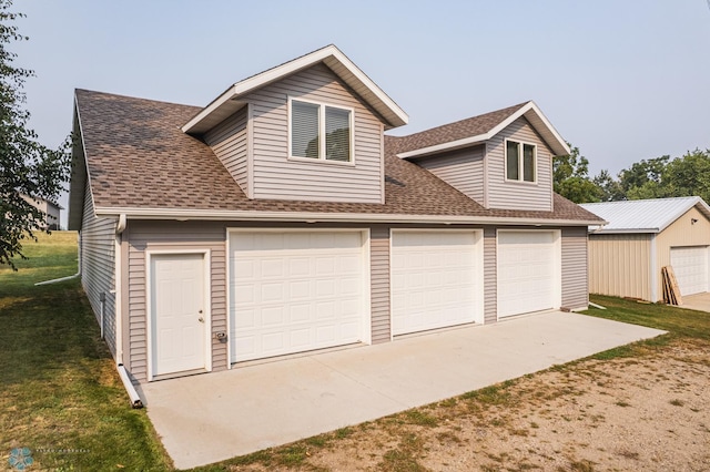 garage featuring a lawn