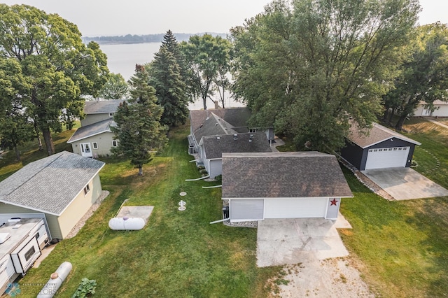 birds eye view of property with a water view