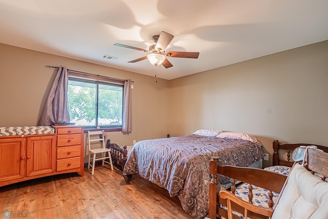 bedroom featuring ceiling fan and light hardwood / wood-style floors