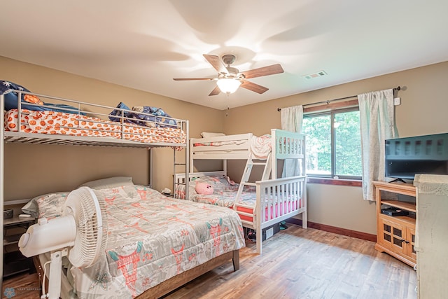 bedroom featuring ceiling fan and wood-type flooring