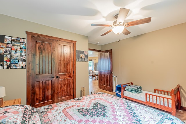 bedroom featuring a closet, ceiling fan, and hardwood / wood-style floors