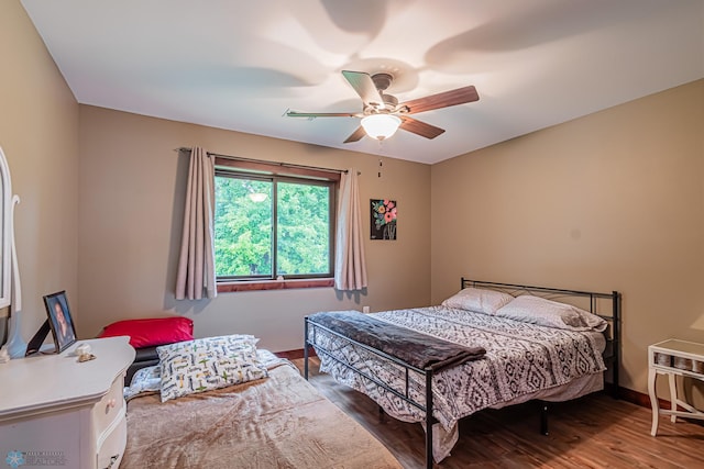 bedroom with ceiling fan and hardwood / wood-style floors