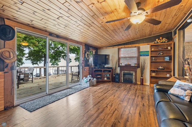 living room with wood ceiling, lofted ceiling, hardwood / wood-style floors, and ceiling fan