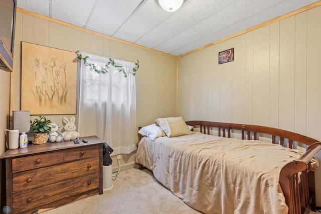 bedroom featuring light carpet