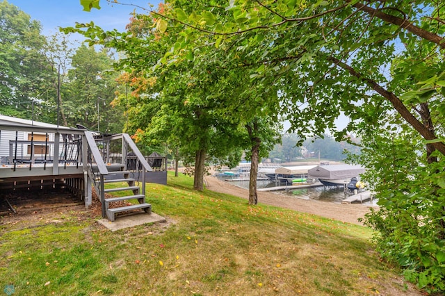 view of yard featuring a deck with water view