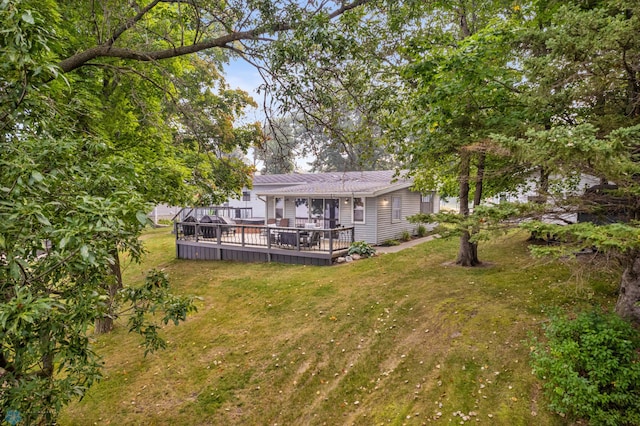 view of yard featuring a wooden deck