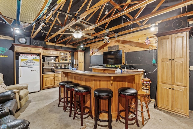 interior space featuring ceiling fan and white refrigerator