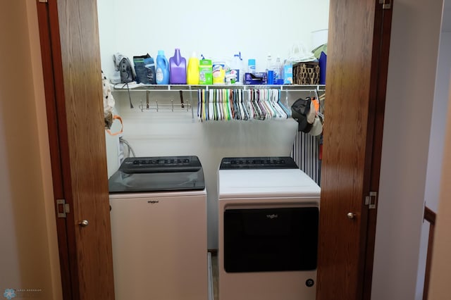 washroom featuring washing machine and dryer