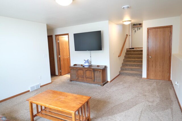 living room featuring light colored carpet