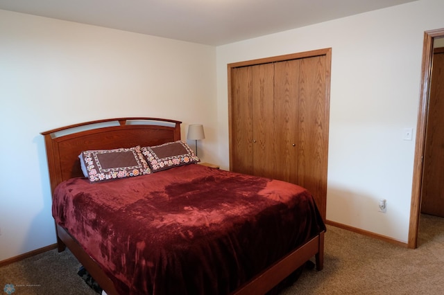 bedroom featuring a closet and carpet