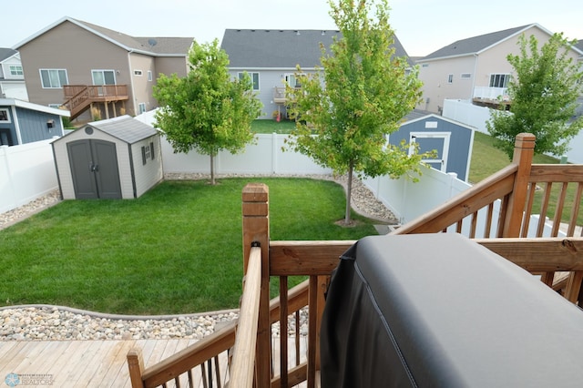 view of yard with a shed and a deck