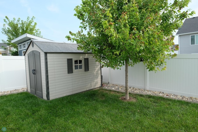 view of outdoor structure with a lawn