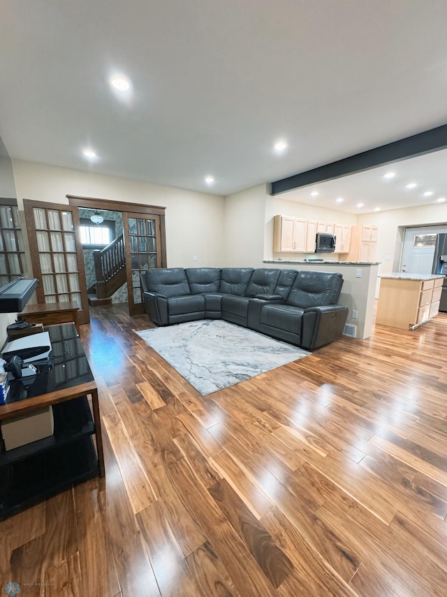 living room with light hardwood / wood-style floors