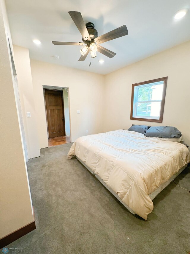 carpeted bedroom with ceiling fan