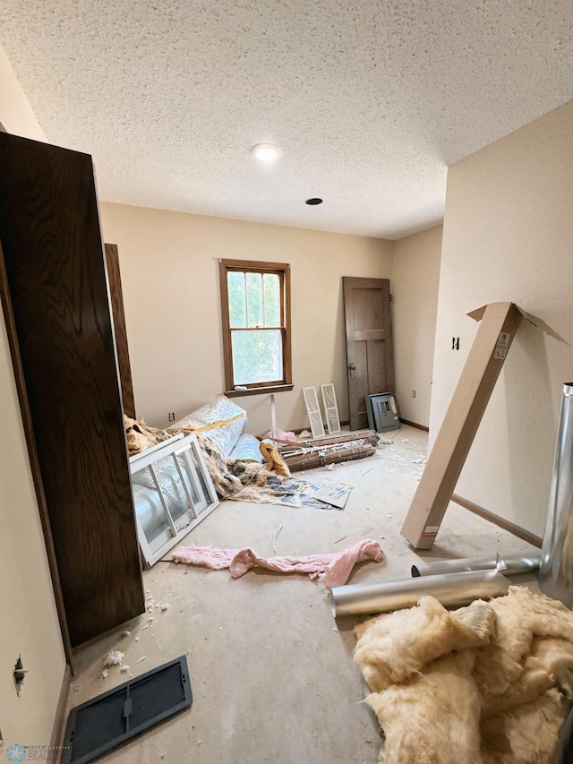 interior space featuring a textured ceiling