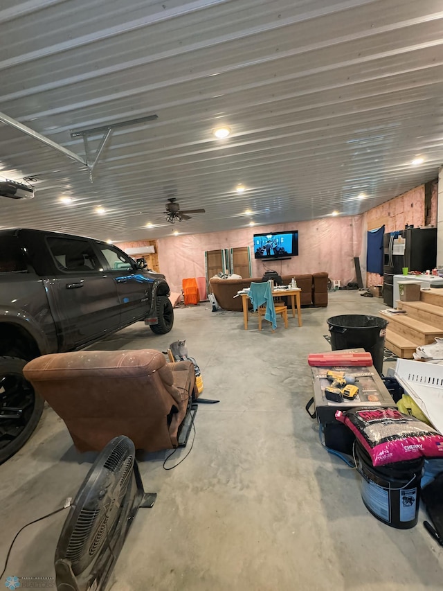 garage featuring ceiling fan and a garage door opener