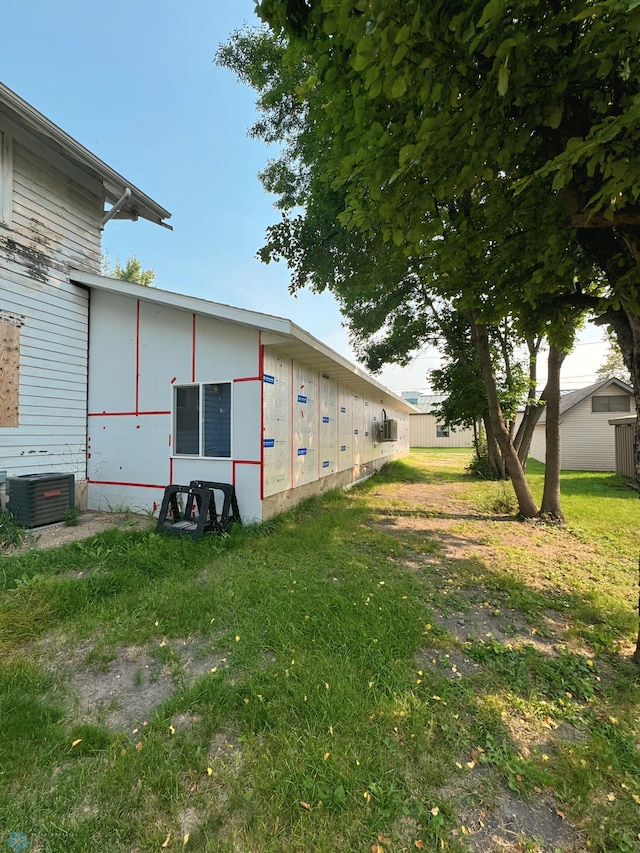 view of yard featuring central air condition unit