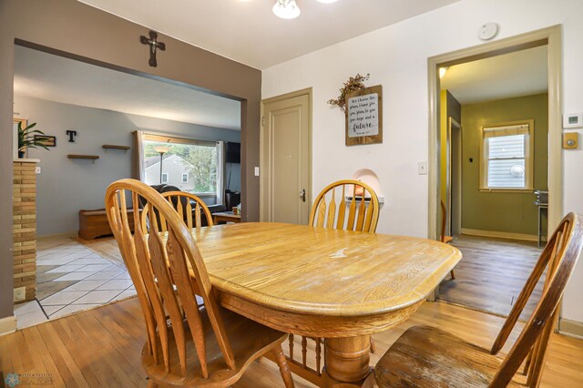 dining space with light hardwood / wood-style flooring