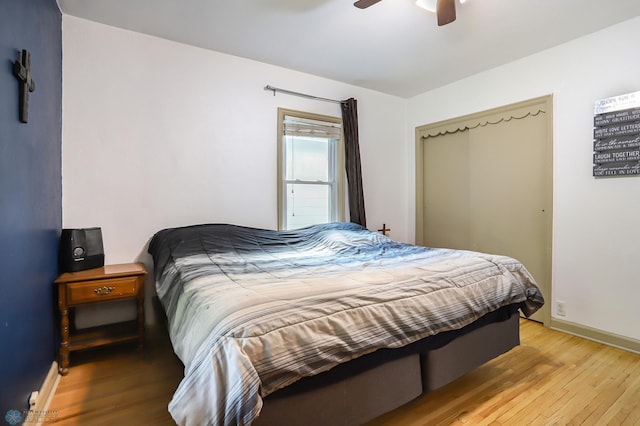 bedroom featuring ceiling fan and light hardwood / wood-style floors