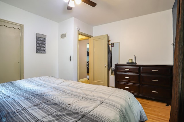 bedroom with ceiling fan and light hardwood / wood-style floors