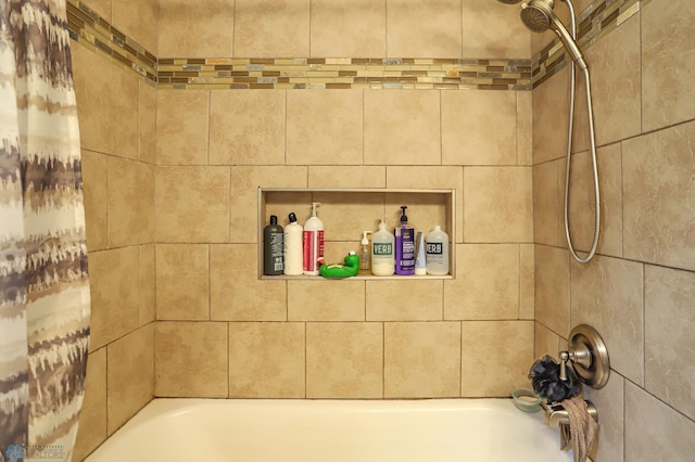 bathroom featuring shower / bathtub combination with curtain