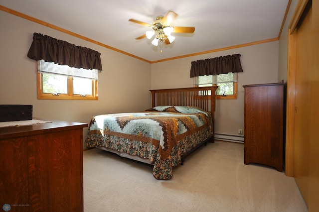 bedroom with multiple windows, light colored carpet, and baseboard heating