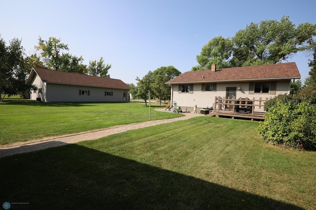 view of yard featuring a wooden deck