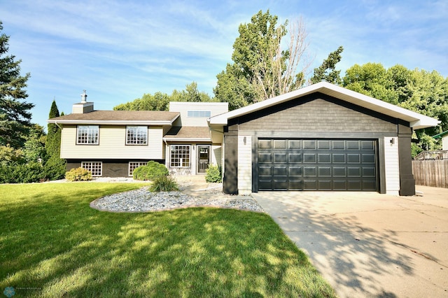 view of front of property with a front lawn and a garage