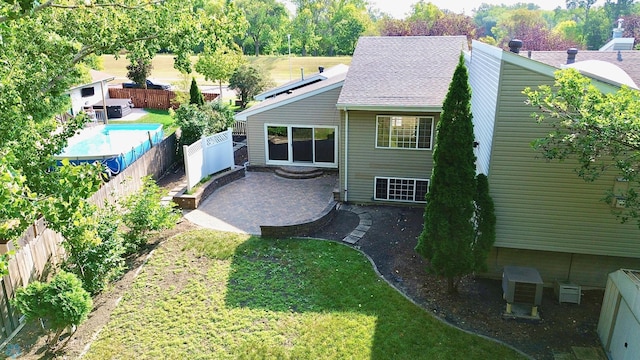 exterior space featuring a patio and a fenced in pool