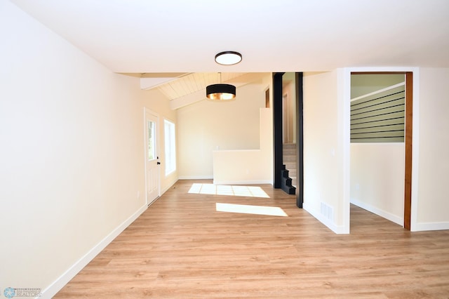 corridor featuring vaulted ceiling with beams and light wood-type flooring