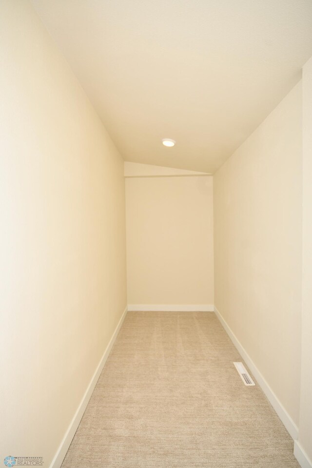 spare room with light colored carpet